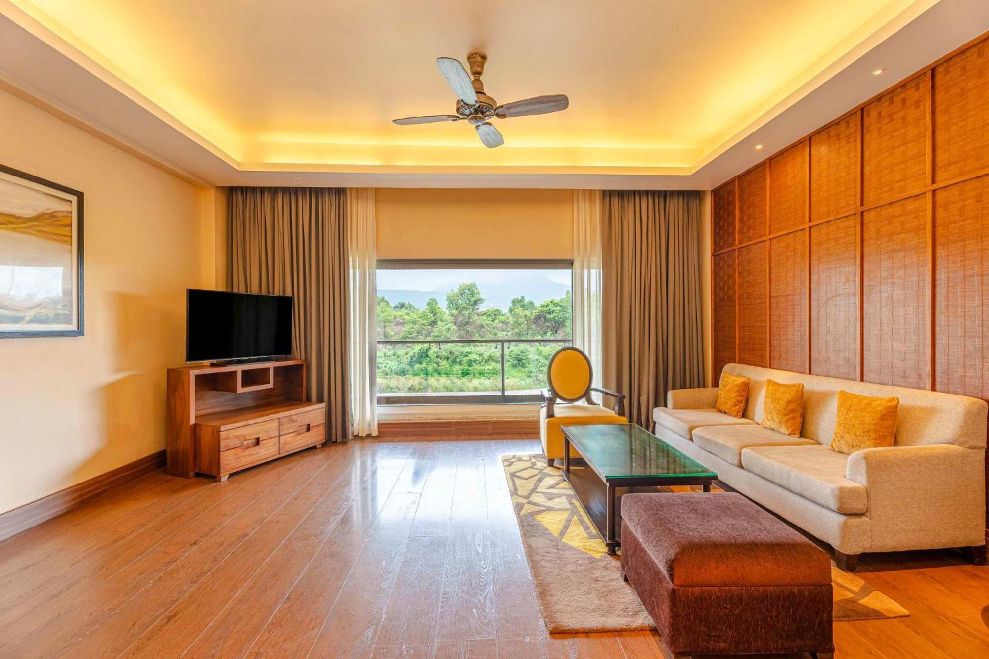 Radisson Blu Plaza Resort & Convention Centre Karjat Exteriör bild Living room of a suite