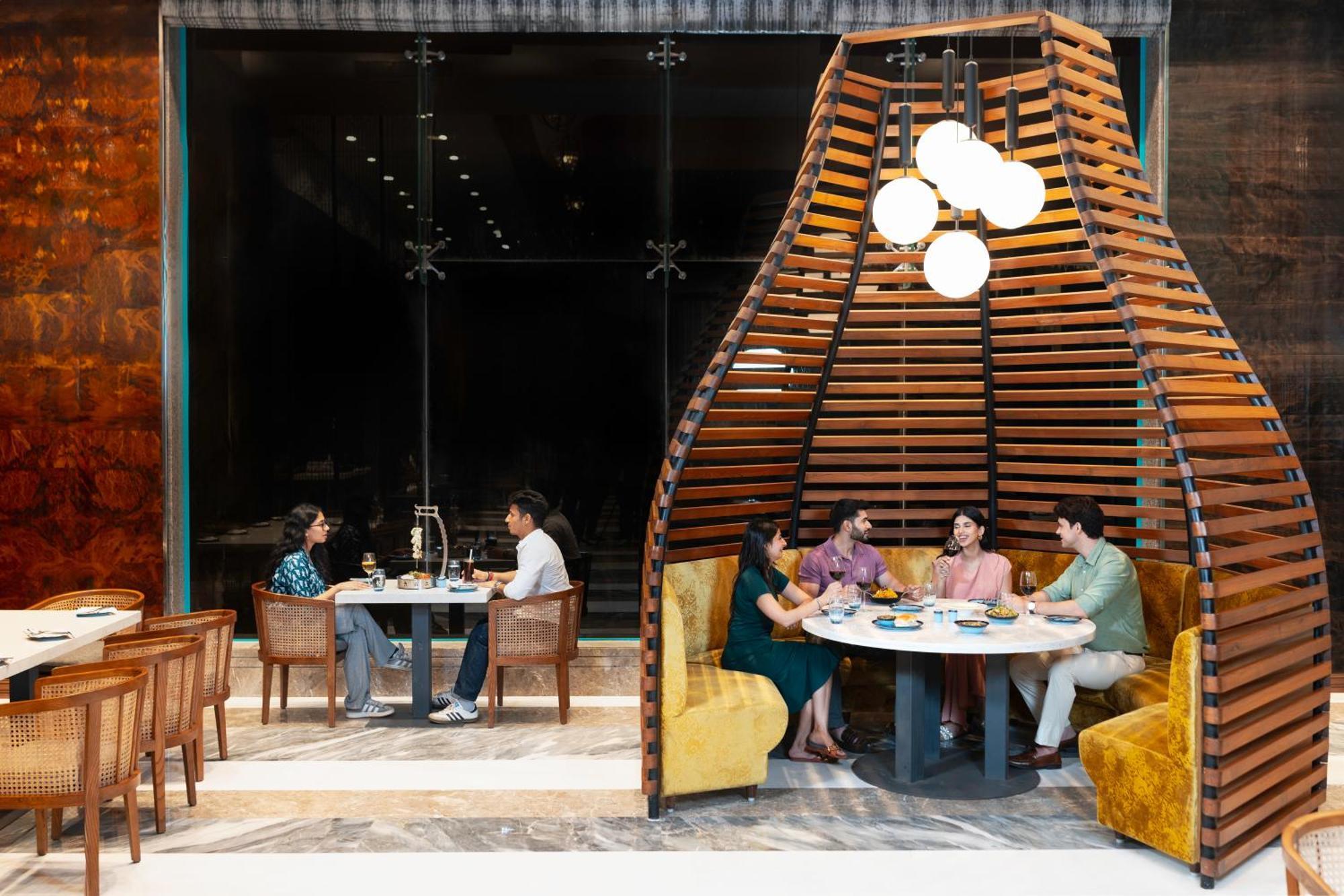 Radisson Blu Plaza Resort & Convention Centre Karjat Exteriör bild The interior of the restaurant